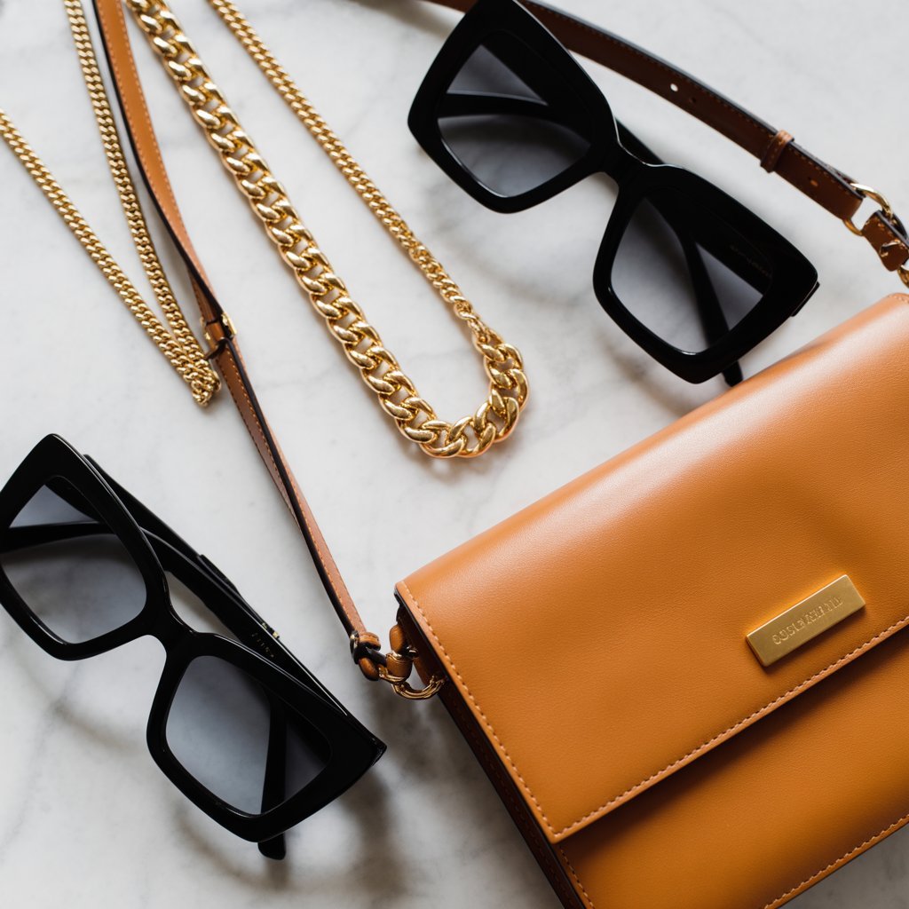 gold chain sunglasses crossbody bag accessories